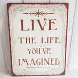 Schild Spruch "Live the life you're imagined"